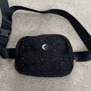 Stylish Black Crossbody Bag with Red Details